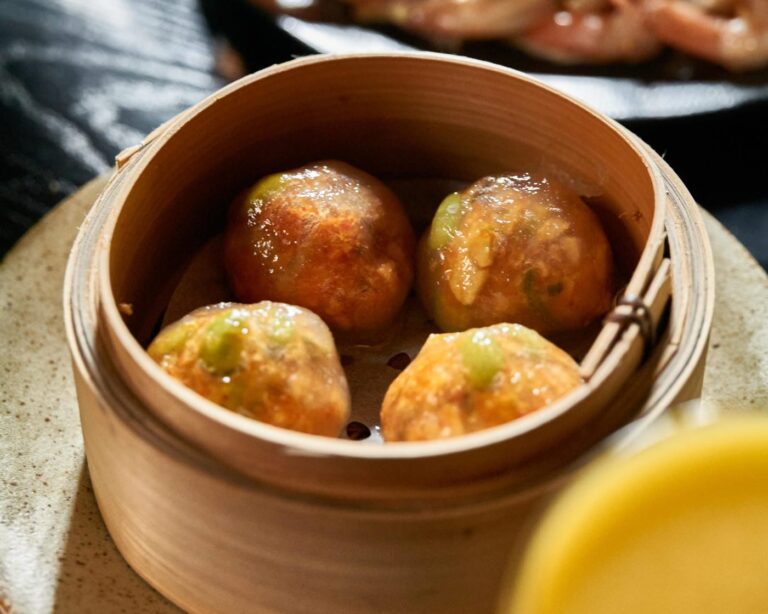 Crystal vegetable dumplings in a bamboo steamer at Zodiac
