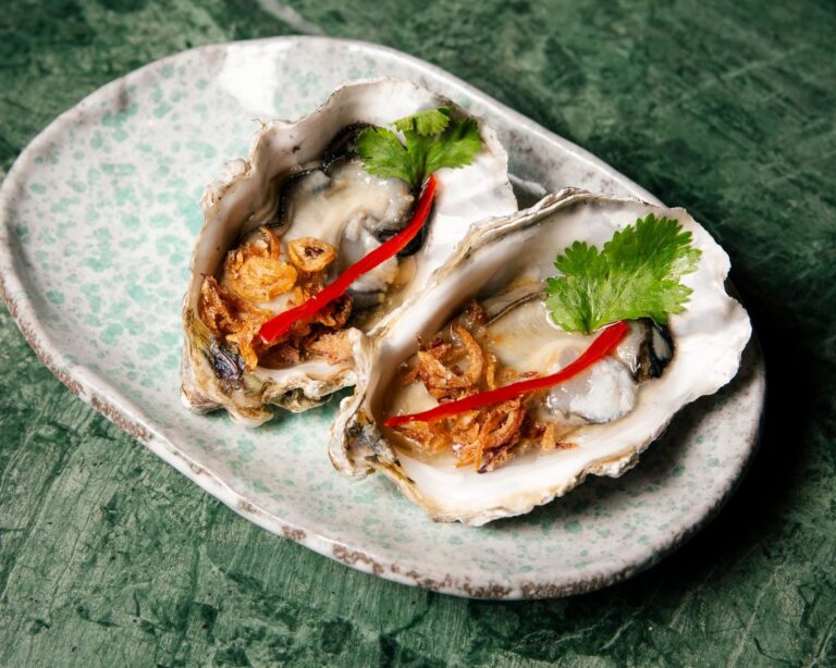 Fresh seasonal oysters with nam jim and fried shallots at Zodiac