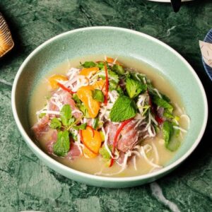 Mandarin marinated yellow fin tuna with fresh coconut, red chilli and lime leaves at Zodiac