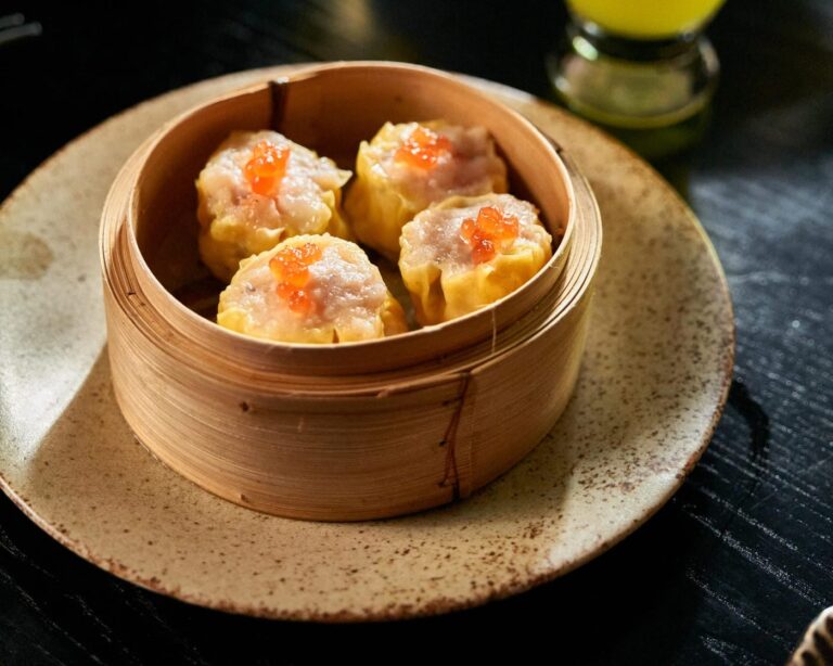 Pork and prawn siu mai in a bamboo steamer at Zodiac